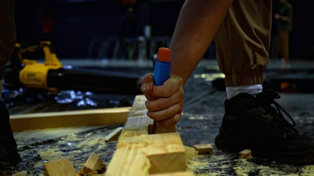 Carpenter using chisel tool for wood working. Media. Carpentry, craftsmanship, handicrafts concept.の写真素材