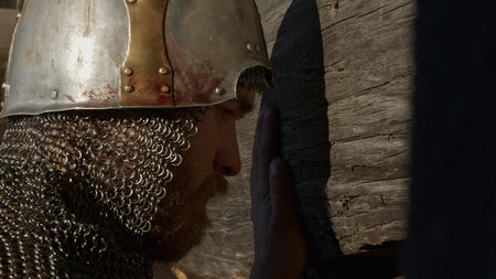 Medieval old knight helmet and chain mail for protection in battle. Media. Close up side view of a...