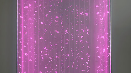 Luminous lamp with water and bubbles. Clip. Mesmerizing wall decor with glowing lamp and bubbles....