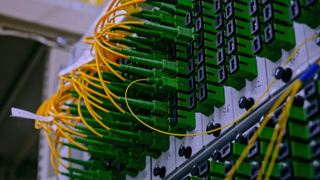 Close up of optical fiber switchboard hub in a server room. Stock footage. Concept of AI, internet,...