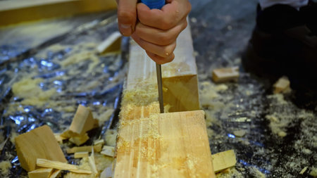 Carpenter using chisel tool for wood working. Media. Carpentry, craftsmanship, handicrafts concept.