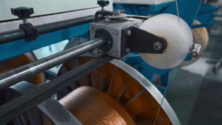 Industrial Machine for winding copper wire on coils. Creative. Automated production of metallurgical...