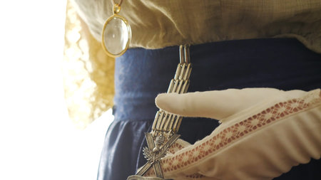 Vintage outfit with decorations. Stock footage. Close-up of vintage jewelry on womens clothing of...