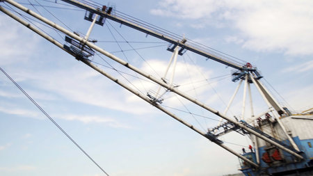 A Heavy Mining Excavator is Actively Working in an Open Pit for Resource Extraction. Stock Clipの写真素材