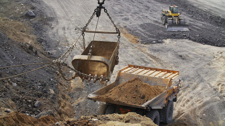 See Heavy Machinery in Action at a bustling Mining Site operating with great efficiency. Stock Clip