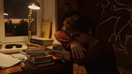 Preparation for the exam late at night. Stock footage. Concept of working late, studies, overworked student.の写真素材