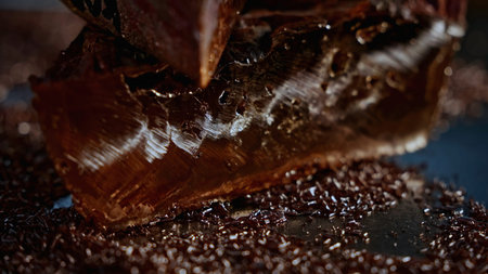 Close up of mica material on a blurred background in sun rays. Stock footage. Natural materials and geology concept.の写真素材