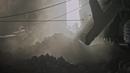 Unloading truck with minerals at factory. Stock footage. Cinematic video of industrial production...