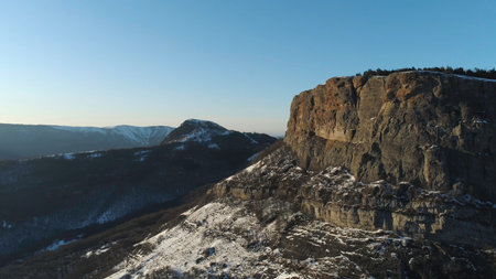 Aerial of snowy inaccessible and very high peaks of the mountains in the northeastern part of Italy on a winter sunny day. Shot. Beauty of european wild nature.の写真素材