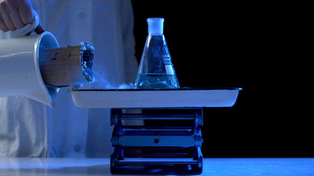 Bottle and liquid nitrogen in a laboratory. Chemical experiment. Flask with water and dry ice...