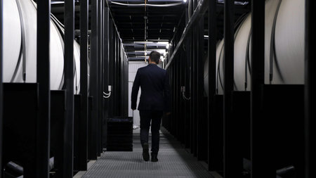 Modern urban wastewater treatment plant. Media. Rear view of a man walking along the water cleaning...