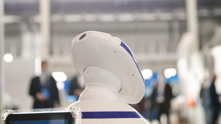 Man stroking robot like pet. Media. Close-up of human hand stroking head of robot dog. New futuristic robots in form of Petsの写真素材