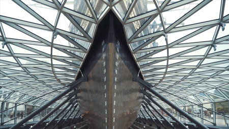 Close-up of the people walking inside of the Cutty Sark ship museum. Action. Built on the Clyde in 1869, it was one of the worlds fastest tea clippers.の写真素材