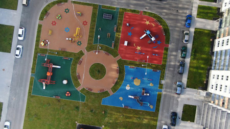 Aerial view of the new children playground at modern complex of apartment residential buildings. Motion. Modern developing infrastructureの写真素材