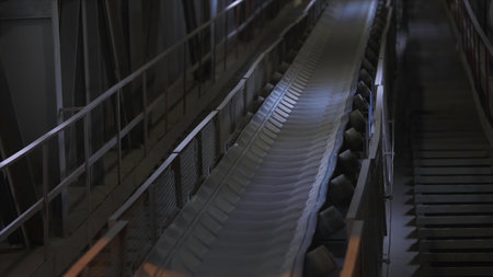Machines working and conveyor line transporting sand. Stock footage. Conveyor belt with small pebble at the concrete mixing plant, factory equipment.の写真素材