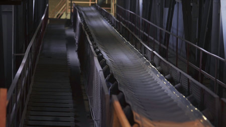 Machines working and conveyor line transporting sand. Stock footage. Conveyor belt with small pebble at the concrete mixing plant, factory equipment.の写真素材