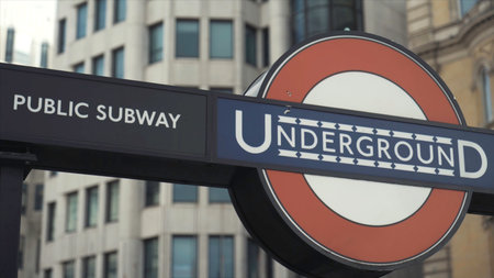 Close-up of the modern logo of the London Transport Underground Railway at the Trafalgar Square to Charing Cross. Action. Famous England landmarksの写真素材