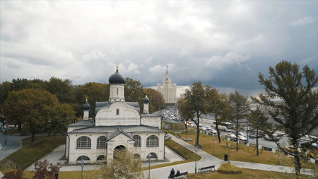Aerial view of the Church of the Conception of St. Anne in the park Zaryadye with black domes and golden crosses against the cloudy sky. Action. Cathedrals of Moscow, temples of Russiaの写真素材