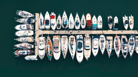 Aerial view of large and small yachts and sailboats moored at the quay. Action. Top view of Boats in Procida, Italyの写真素材