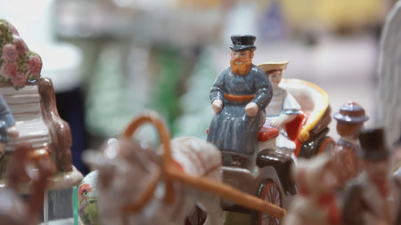 YEKATERINBURG, RUSSIA - FEBRUARY 25, 2022: Ceramic figurines depicting peasants and townspeople....