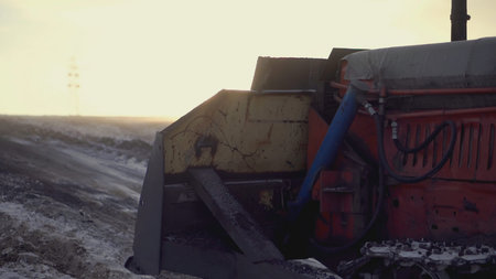 CLIP. In the foreground, a tractor is pulling a heavy load. In the video, people walk and tractors...