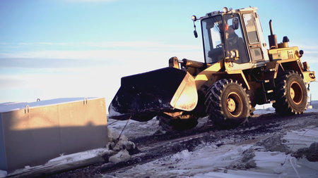 Big tractor. CLIP. In the foreground, a tractor is pulling a heavy load. In the video, people walk...