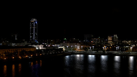 Aerial view of night cityscape of Yekaterinburg City with Vysotsky business skyscraper, Russia. Stock footage. Colorful evening night illumination and Iset river.の写真素材