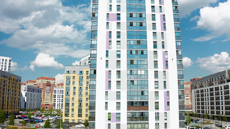 Top view of beautiful residential buildings on sunny day. Stock footage. Well-maintained beautiful streets with modern residential complexes. Modern residential area on sunny summer dayの写真素材