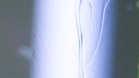 White background. Stock footage. A white heavy liquid that spreads, but in it, because of the...