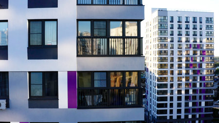 Beautiful new neighborhood. A bright landscape from a drone with new high-rise buildings and next to them the roads on which cars drive and the blue sky overhead.の写真素材