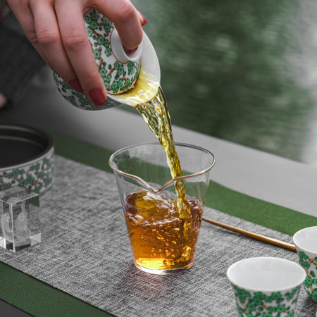 Experience the exquisite art of elegant tea pouring beautifully showcased in a modern setting