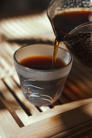 Pouring a delightful cup of tea into a delicate and elegant glass cup can be a beautiful momentの写真素材
