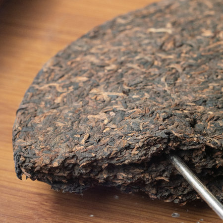 A Stunning CloseUp View of Compressed Puerh Tea Cake for Tea Enthusiasts and Connoisseursの写真素材