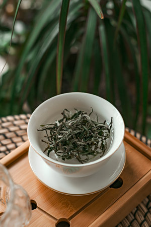 Fresh Green Tea Leaves in a Traditional Bowl, showcasing elegance and simplicity