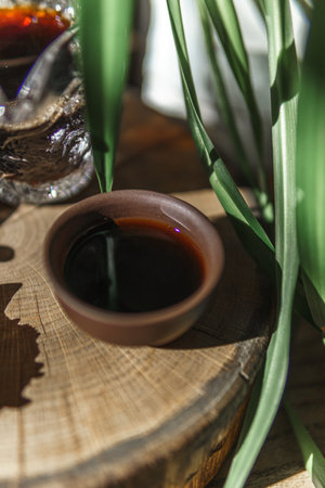 An Artistic CloseUp of Rich Dark Syrup Presented Beautifully in a Rustic Settingの写真素材