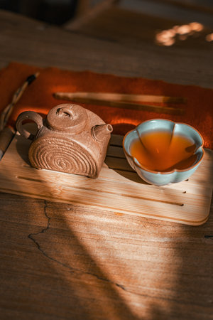 An Artistic Tea Setup featuring a beautifully designed Teapot and an elegant Tea Cupの写真素材