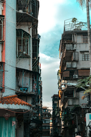 Urban Alleyway Featuring a Variety of Unique Architectural Structures and Elementsの写真素材