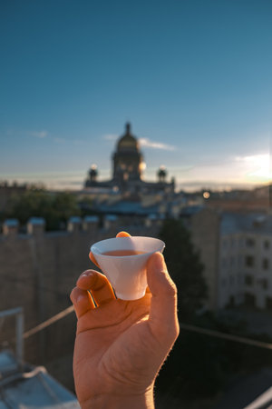 A toast in an iconic cityscape showcases architecture, friendship, and joyous celebrationの写真素材