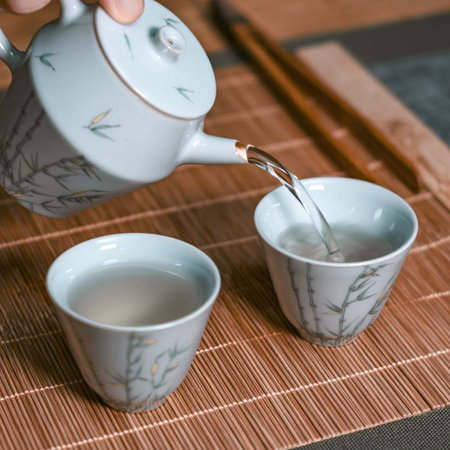 Elegant Tea Pouring in Traditional Ceramics A Beautiful Display of Craftsmanship and Culture