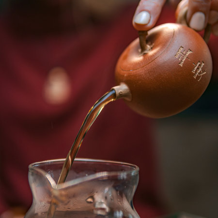 Aesthetic Pour of Herbal Tea from a Gourd, beautifully presented for an inviting experienceの写真素材