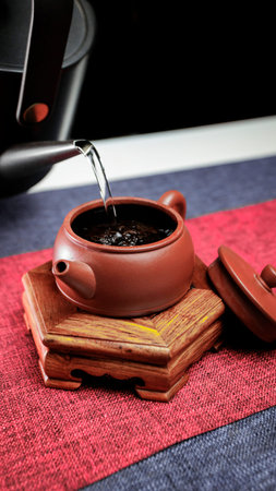 The Art of Tea Brewing Process Using an Elegant Yixing Teapot on a Beautiful Textured Surface