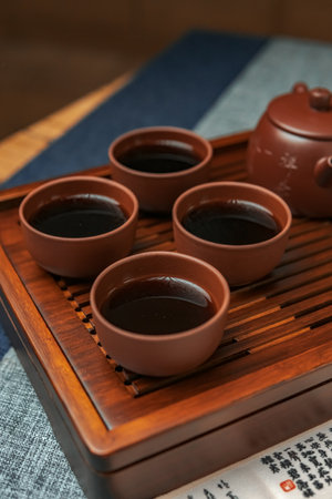 An Elegant Tea Set Display featuring Beautiful Traditional Teacups ready for enjoymentの写真素材