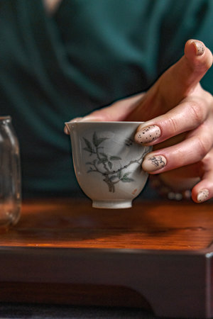A beautifully Elegant Teacup with an Intricate Design, sitting gracefully in a Calm Settingの写真素材