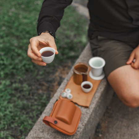 Experience the joy of outdoor tea enjoyment while utilizing traditional brewing toolsの写真素材