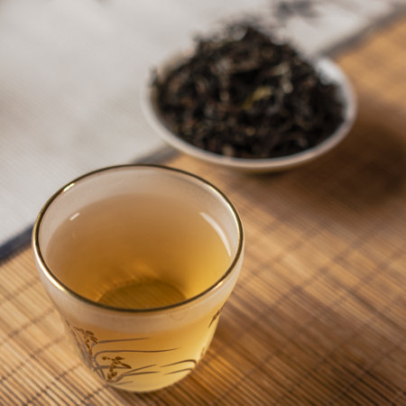 Indulge in a Calming Tea Experience Featuring Natural Leaves Served in a Glass Cupの写真素材
