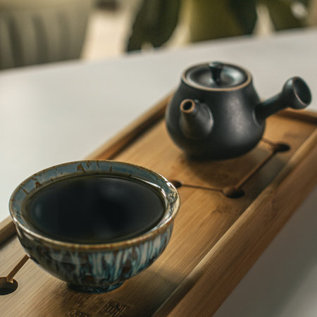An Elegant Tea Set Displayed Beautifully on a Bamboo Tray, an Ideal Aesthetic Choice for Relaxation