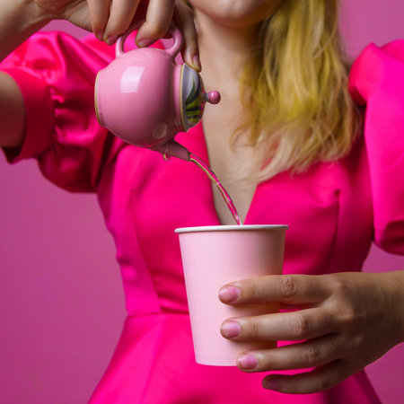 An Elegant Pink Tea Party That Features a Stylish and Graceful Experience of Pouring Beveragesの写真素材
