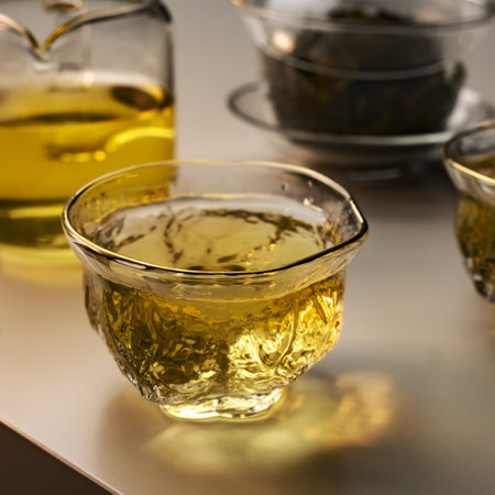 Enjoy the exquisite experience of Delicate Green Tea served in Elegant Glassware todayの写真素材