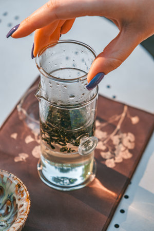 Savor a calming herbal tea, expertly made in a beautiful glass teapot for an aromatic infusion