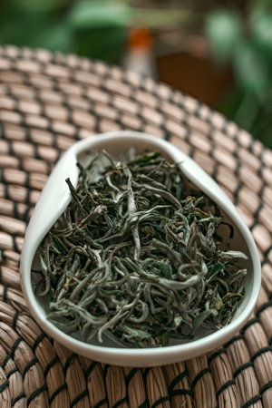 Dried Green Tea Leaves arranged beautifully in an elegant bowl for aesthetic appeal